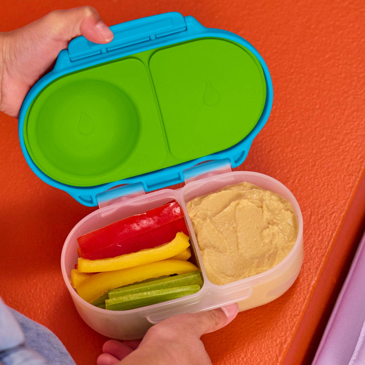 Child-friendly grip clips promote independent snack access