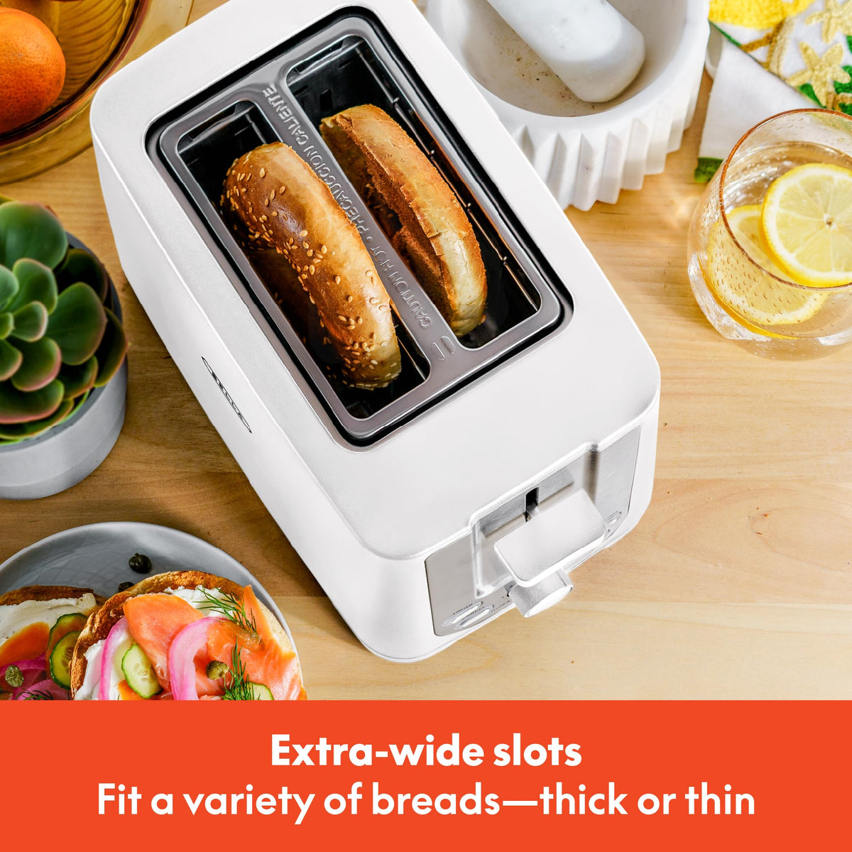 BELLA 2-Slice Toaster removable crumb tray for quick cleanup after breakfast.