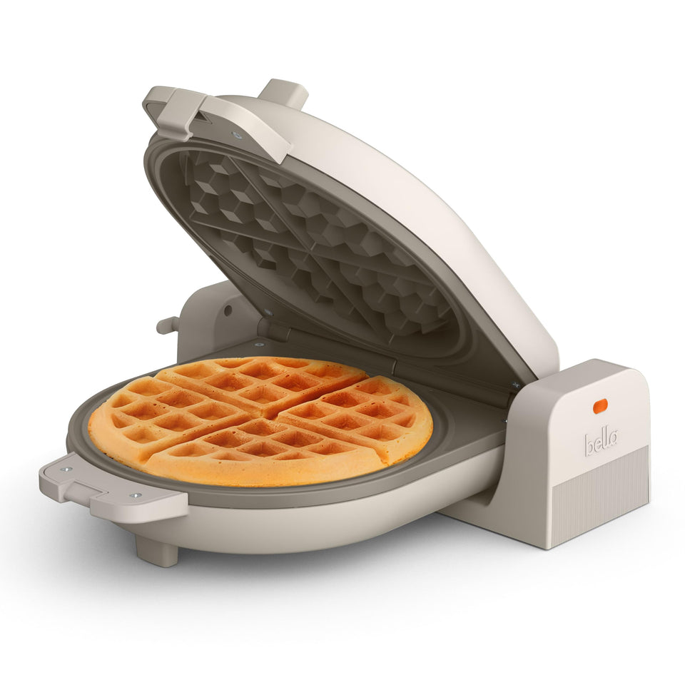 BELLA Flip-n-Store waffle maker front view shows compact oatmilk finish and space-saving design.