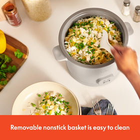 BELLA rice paddle in use for easy serving and precise portions.