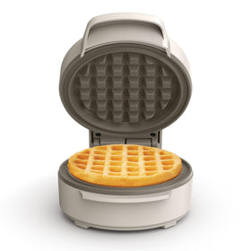 BELLA Snack-n-Store mini waffle maker front view, compact design ideal for small kitchens.