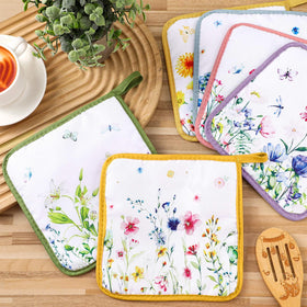 Vibrant floral-design pot holders doubling as a decorative trivet.