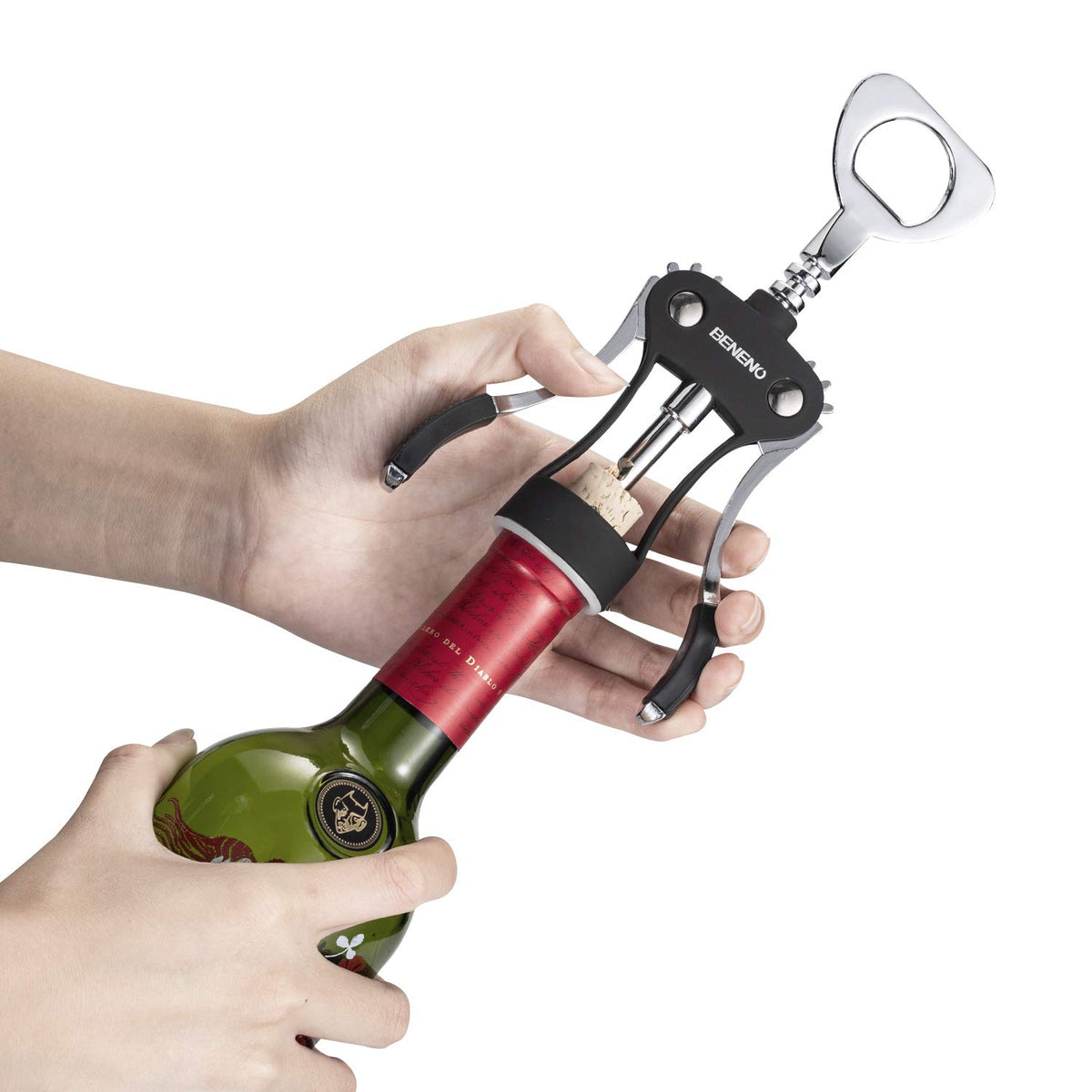 Beneno corkscrew in action delivering a clean pour at a dinner party.