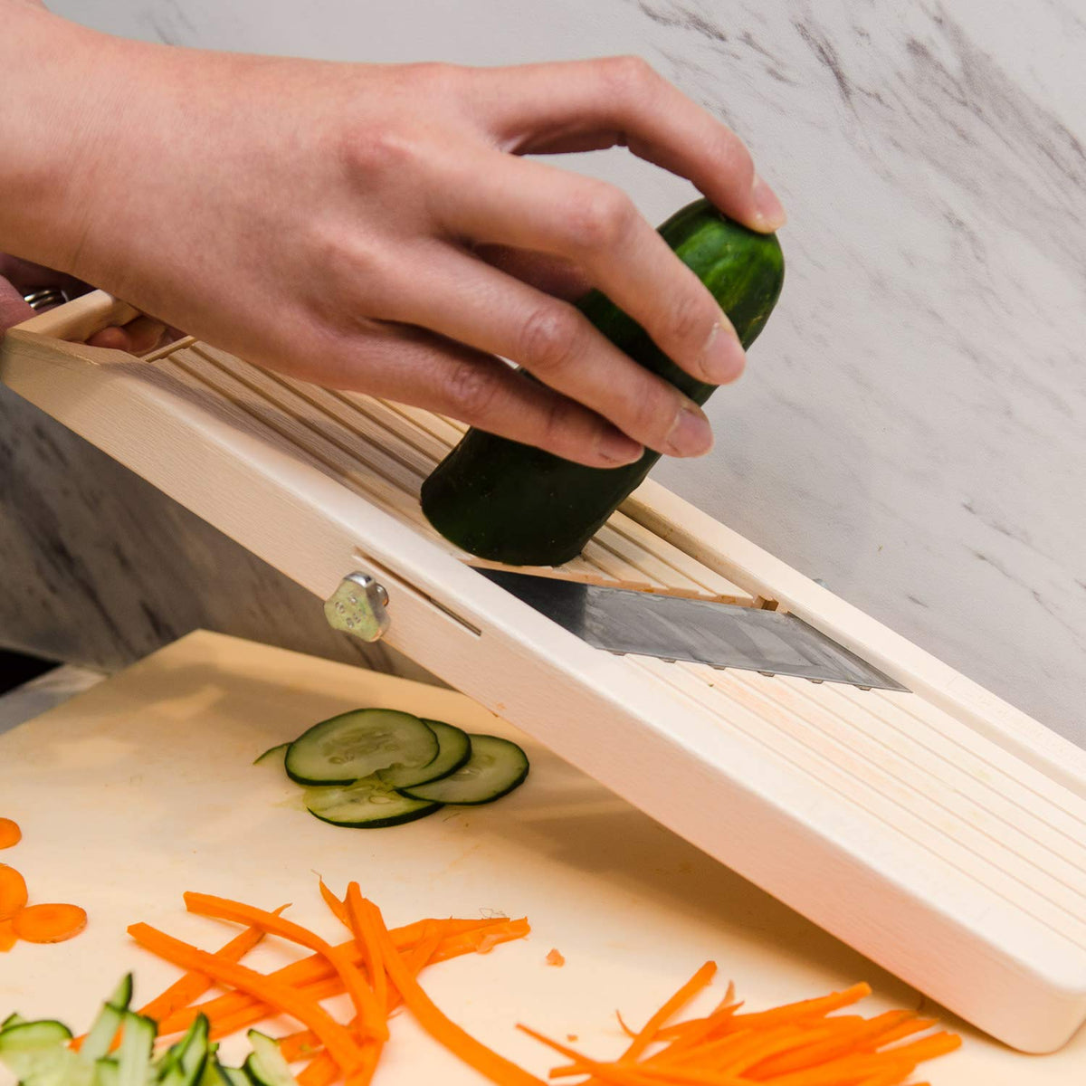 Benriner Japanese Vegetable Slicer adjustable-thickness demonstrates fine to medium slices.