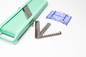Benriner Japanese Vegetable Slicer three-slice-sizes with coarse blades enable varied cuts.