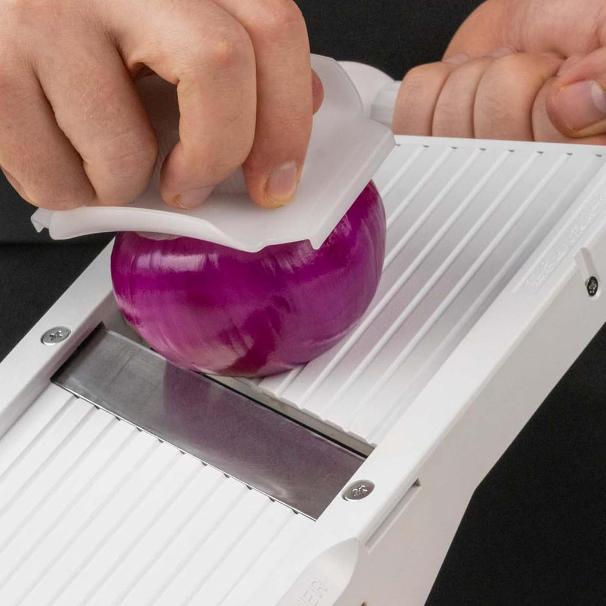 Benriner safety guard protects fingers during slicing