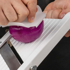 Benriner mandoline safety guard protects fingers when handling small pieces.