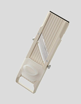 Benriner No. 64 interchangeable blades enable fine, medium, and coarse cuts.