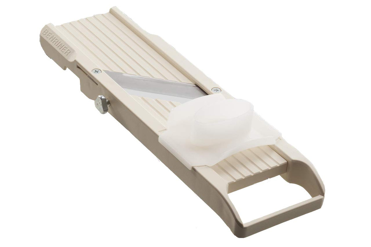 Benriner No. 64 ivory mandoline assembled for precise, even slices.
