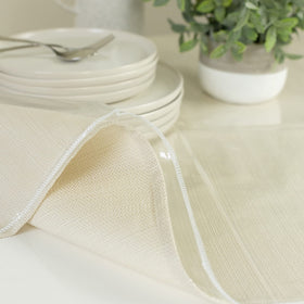Benson Mills waterproof tablecloth shields furniture from liquid messes.