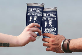 BETHEGIFT Dad tumbler 20oz navy side view fits car cup holders while preserving temperature.