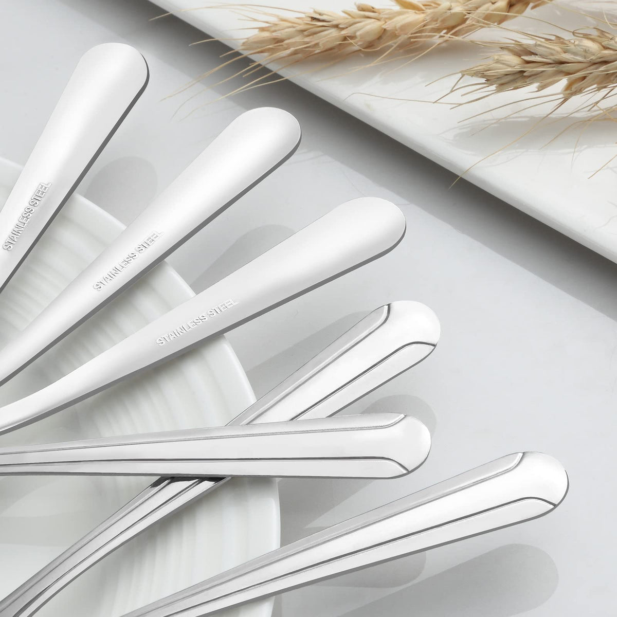 BEWOS mirror-polished teaspoons gleaming on the table surface