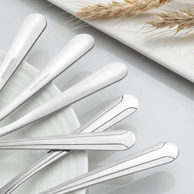 BEWOS mirror-polished teaspoons gleaming on the table surface