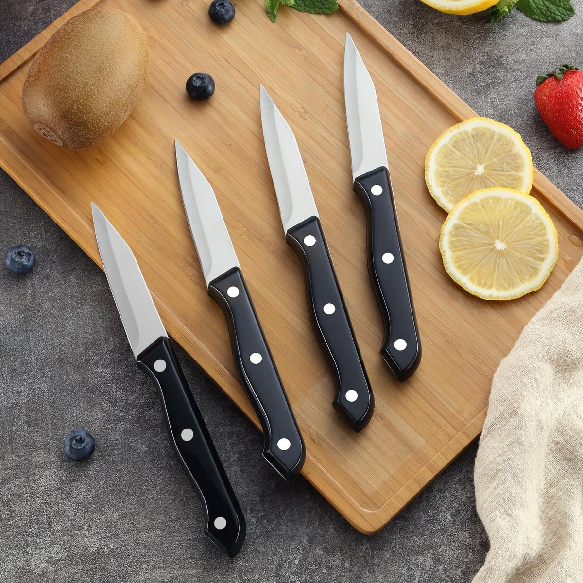 BEWOS multipurpose paring knife in use for peeling and trimming.