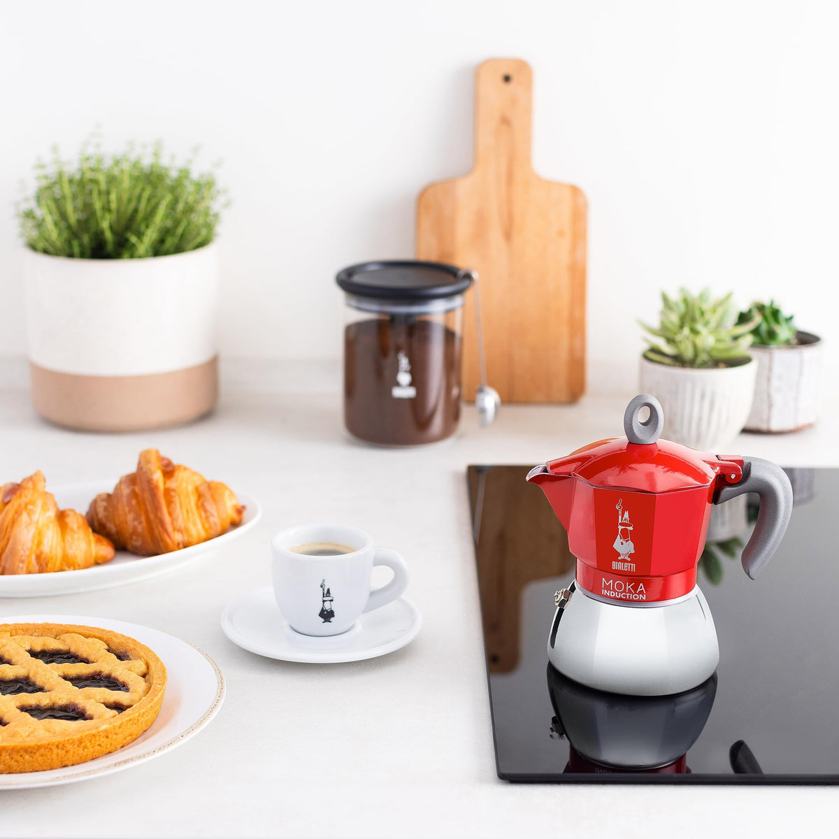 Top view of Bialetti Moka Induction in red, safety valve visible
