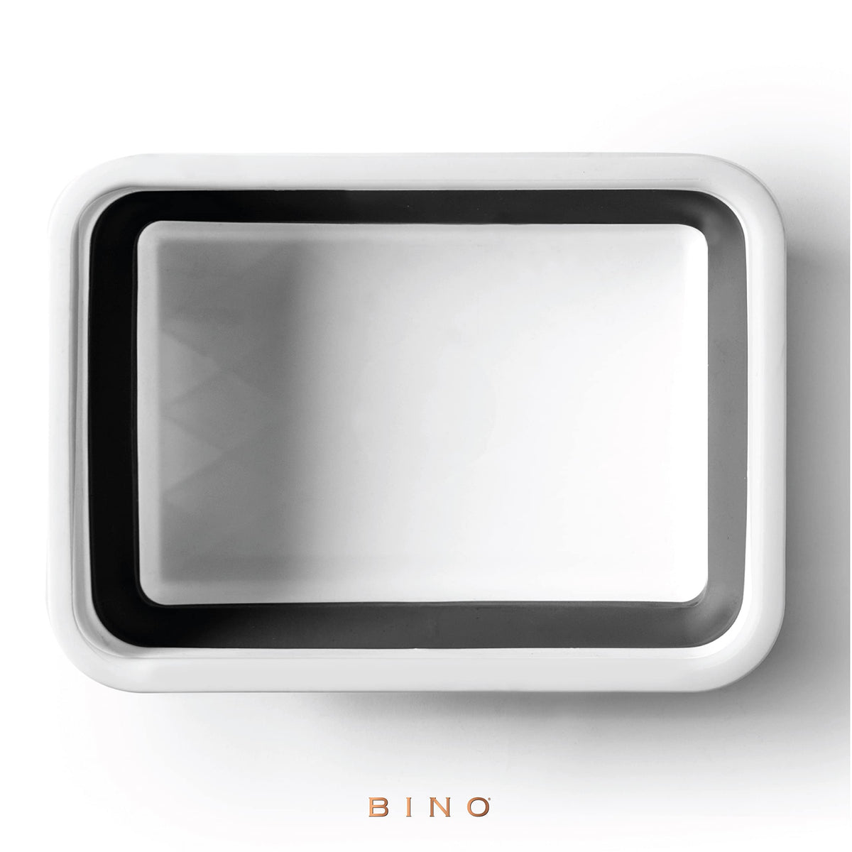 BINO collapsible wash basin being used for soaking dishes or laundry.