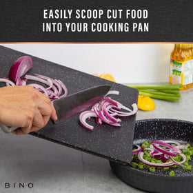 BINO dual-sided cutting board enables separate prep to prevent mingling.