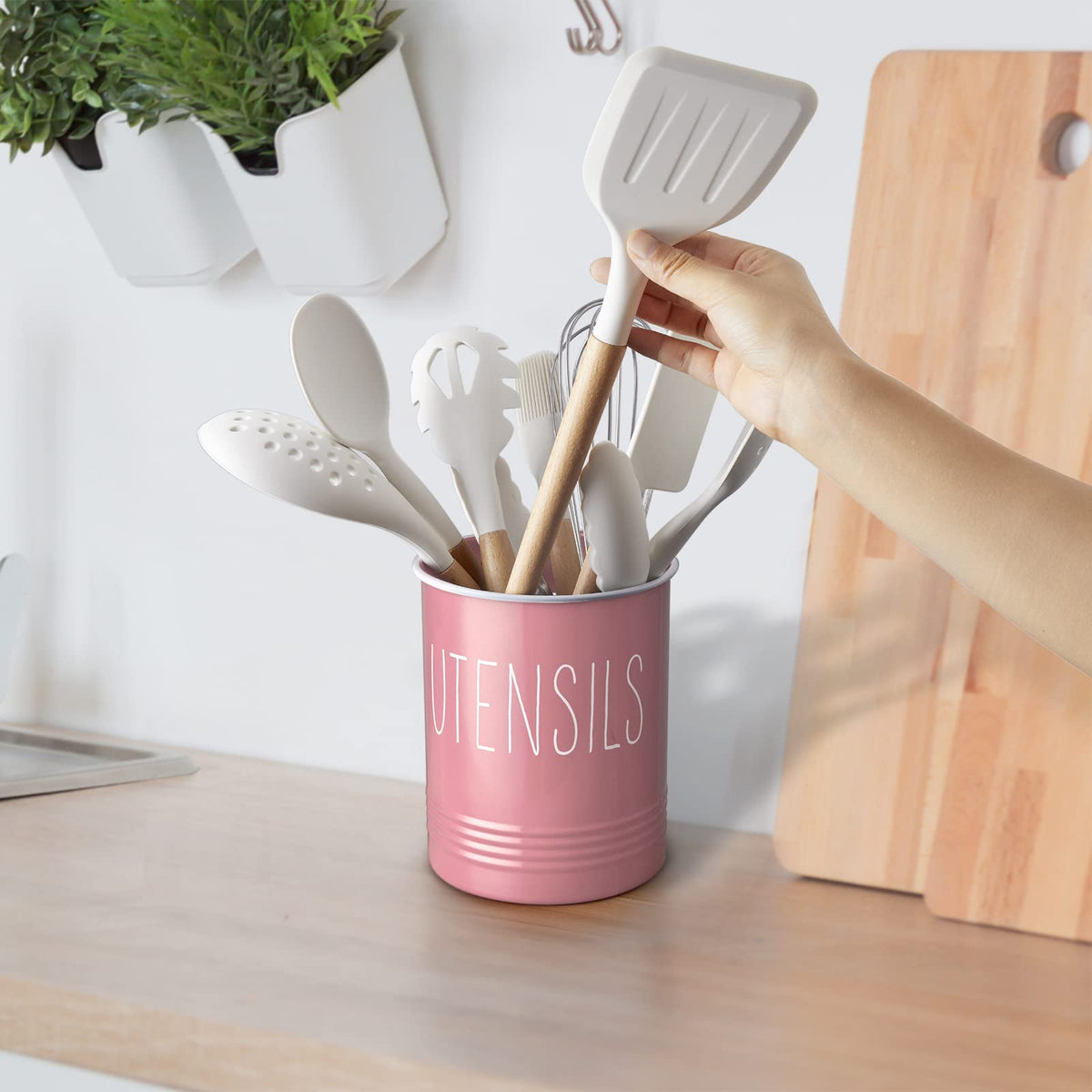 Bivvclaz storage solution helps organize spoons, whisks, and tongs.