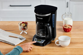 BLACK+DECKER 12-Cup coffee maker pouring action into a mug