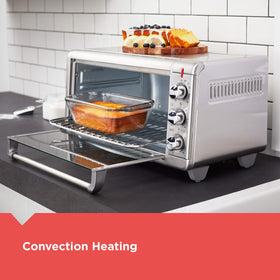 BLACK+DECKER control knobs for simple bake, broil, toast, and warm settings.