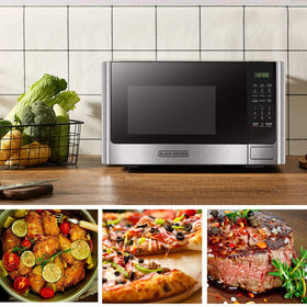 Push-button door release on Black+Decker microwave for easy access