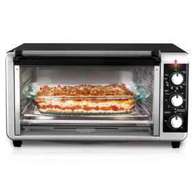 BLACK+DECKER TO3250XSBD countertop oven on kitchen counter for versatile cooking.