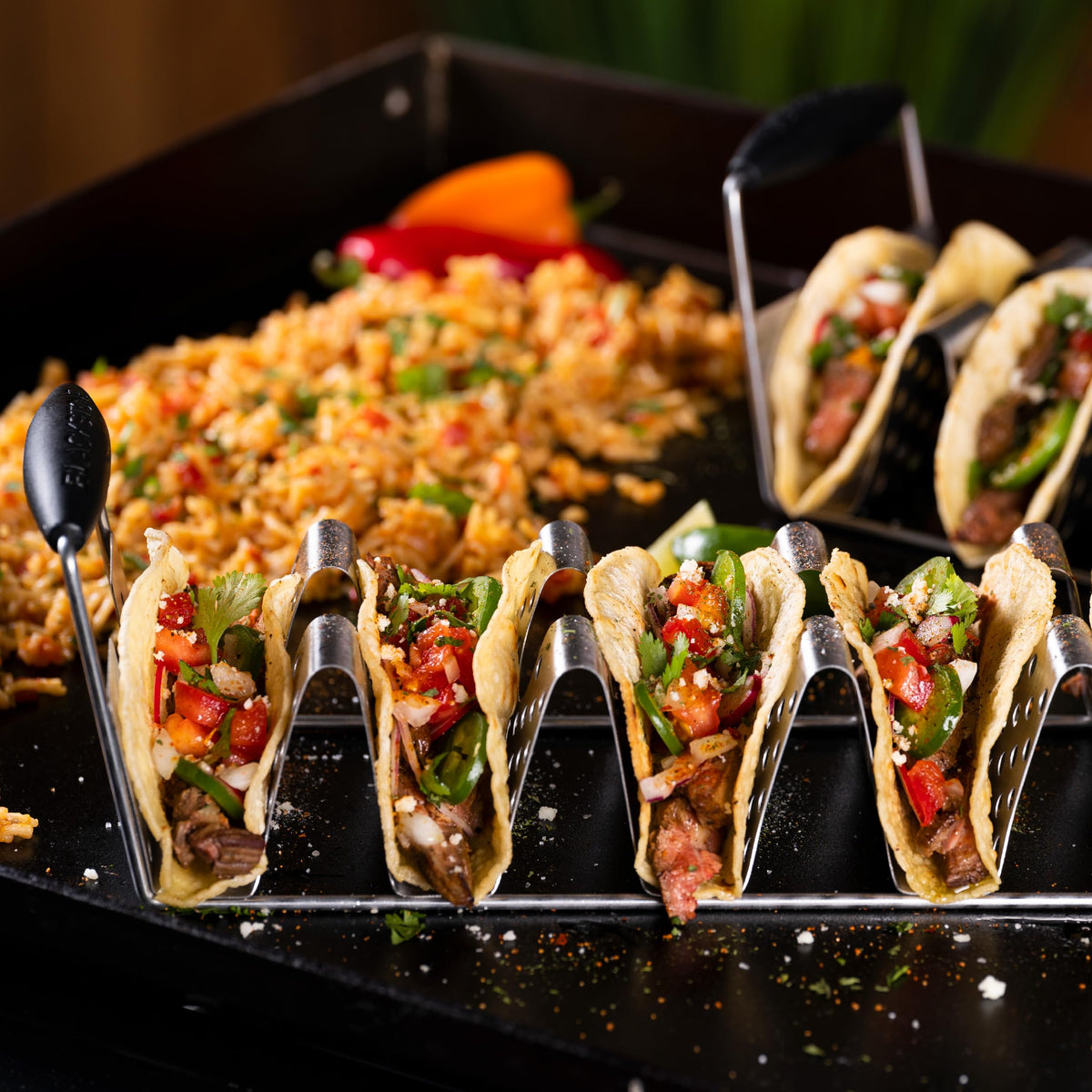 Blackstone deluxe taco holder with heat-resistant handles for safe transport of hot food