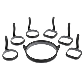 Blackstone egg ring kit on griddle delivering perfectly round eggs.