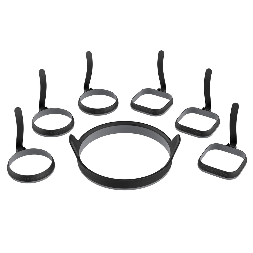 Blackstone egg ring kit on griddle delivering perfectly round eggs.