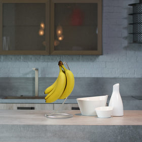 Blue Donuts chrome banana stand pairs with appliances for a sleek kitchen