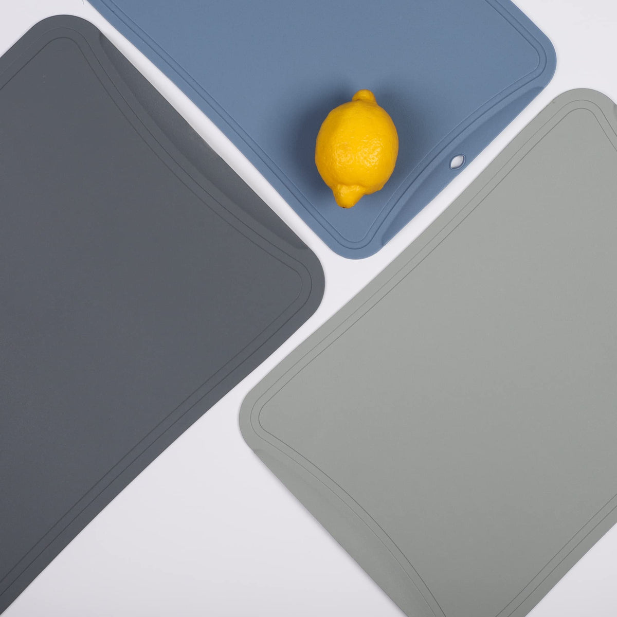 Blue Ginkgo cutting mats with juice grooves help keep counters clean.