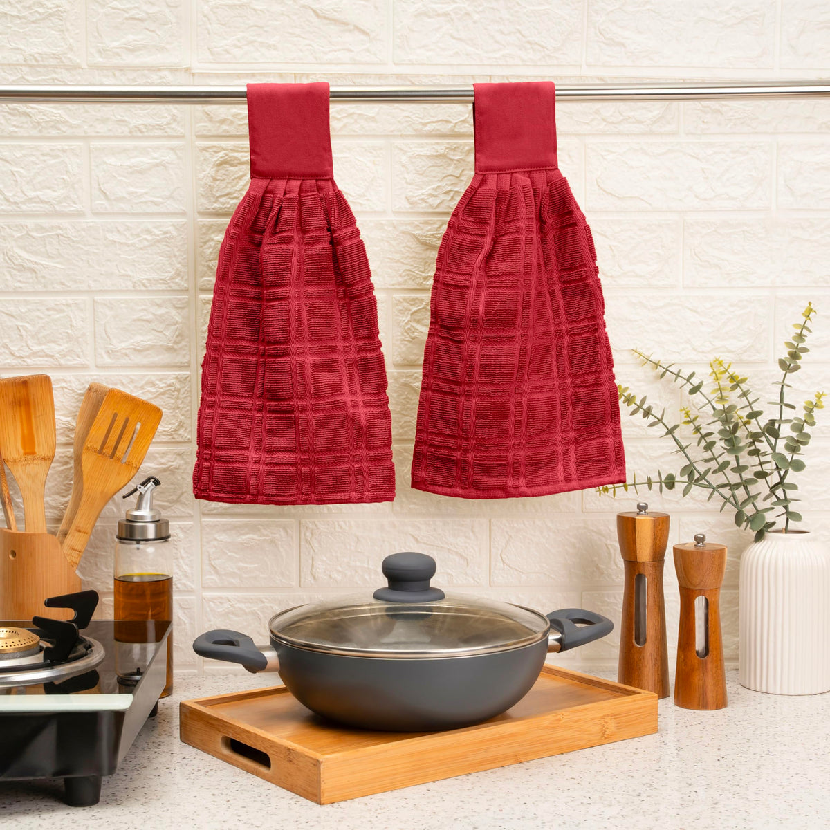 Blue Needles red towel close-up emphasizes absorbent fabric for spills.