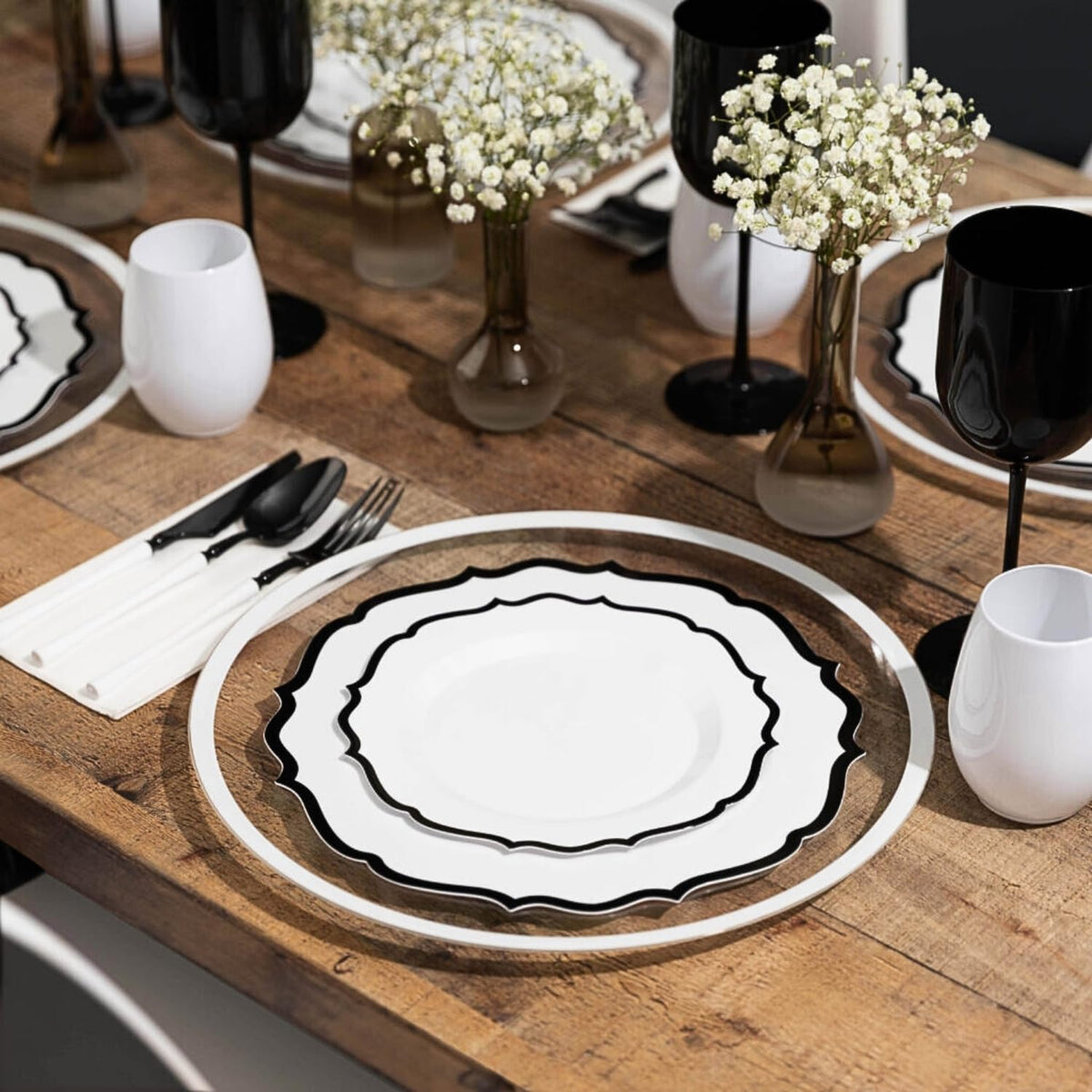 BLUESKY stackable white plates with black rims demonstrating space-saving design.