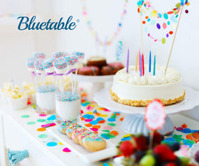 Bluetable blue tablecloth in party scene, yields clean, quick disposal after celebrations.
