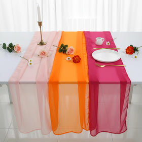 Boao outdoor dinner scene using pink-orange runners for sunset-inspired decor