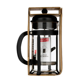 Bodum Java plunger detail shows stainless steel filter preventing grounds in cup.