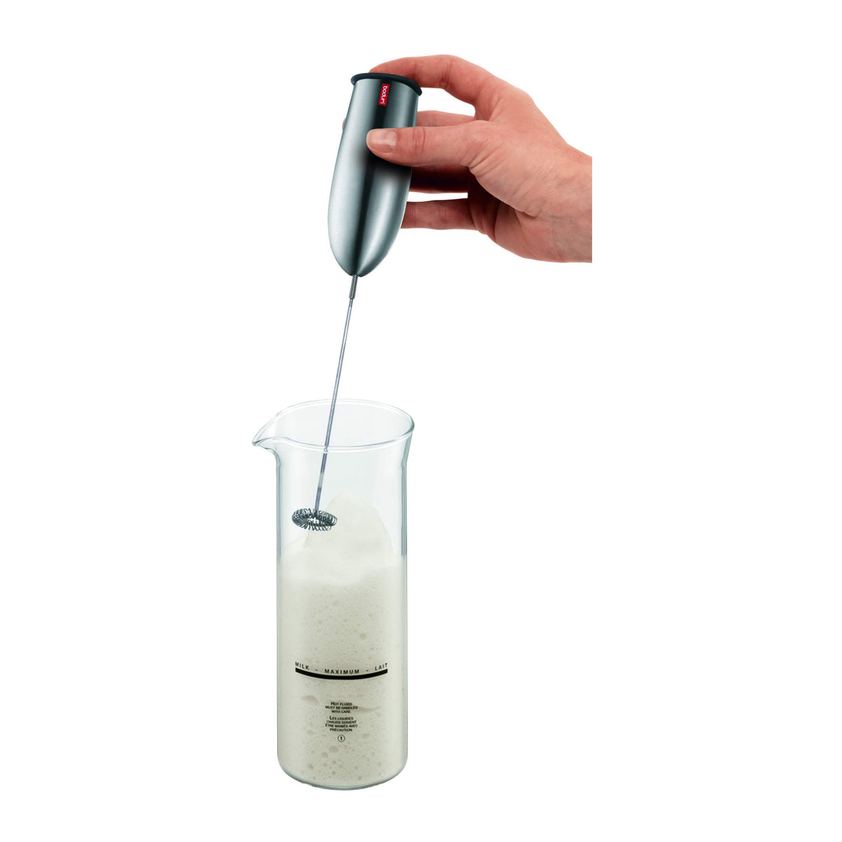 Bodum Schiuma stainless steel wand being rinsed for easy cleaning.