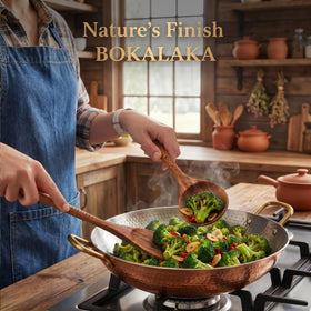 BOKALAKA teak frying spatula with a comfortable grip for even flipping.