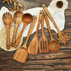 BOKALAKA teak-slotted-shovel enables draining liquids while cooking.