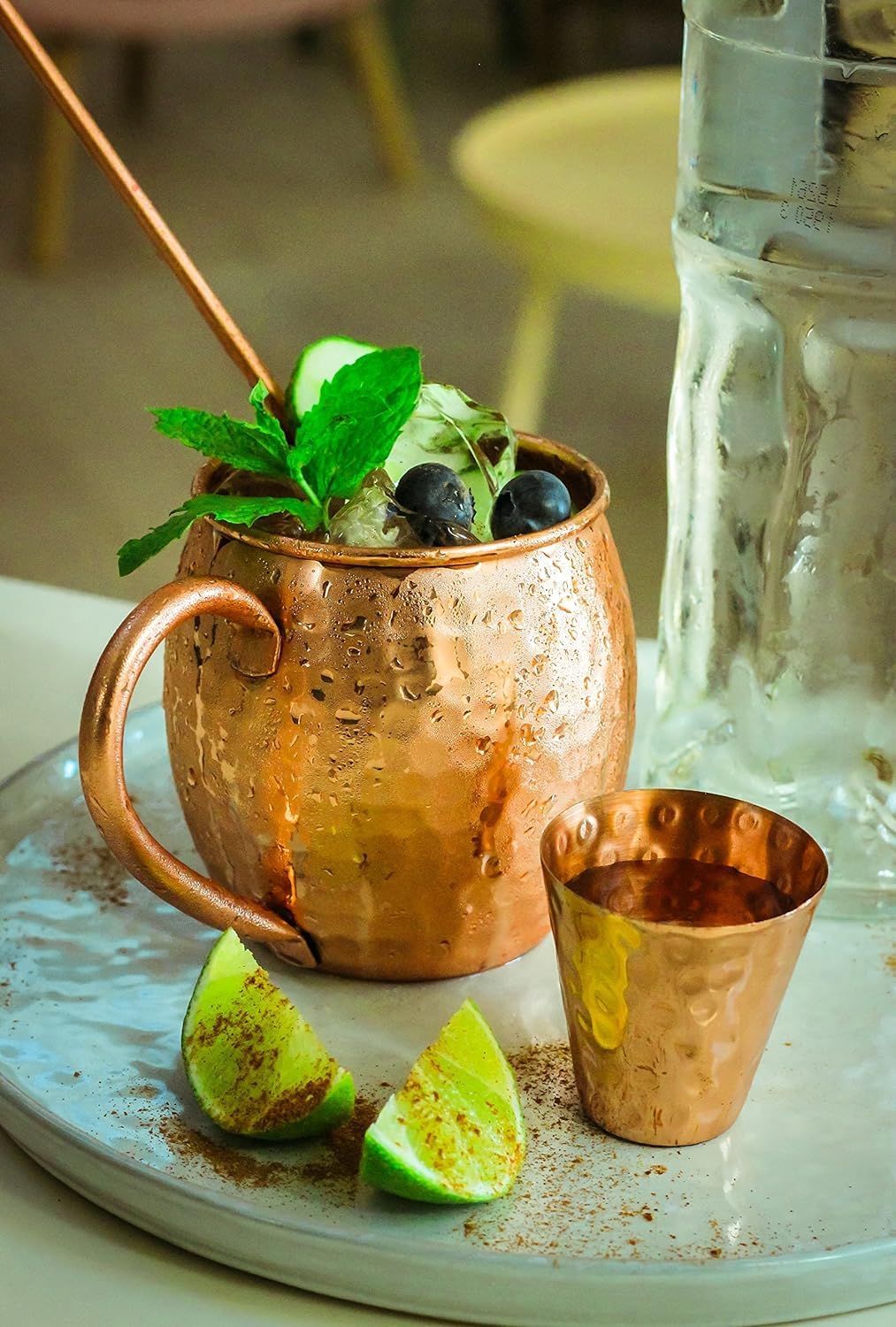 Bold and Divine copper straws and shot glass complement the set.