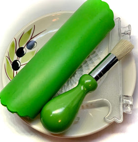 BonCera gathering brush removes shredded pieces from the plate.