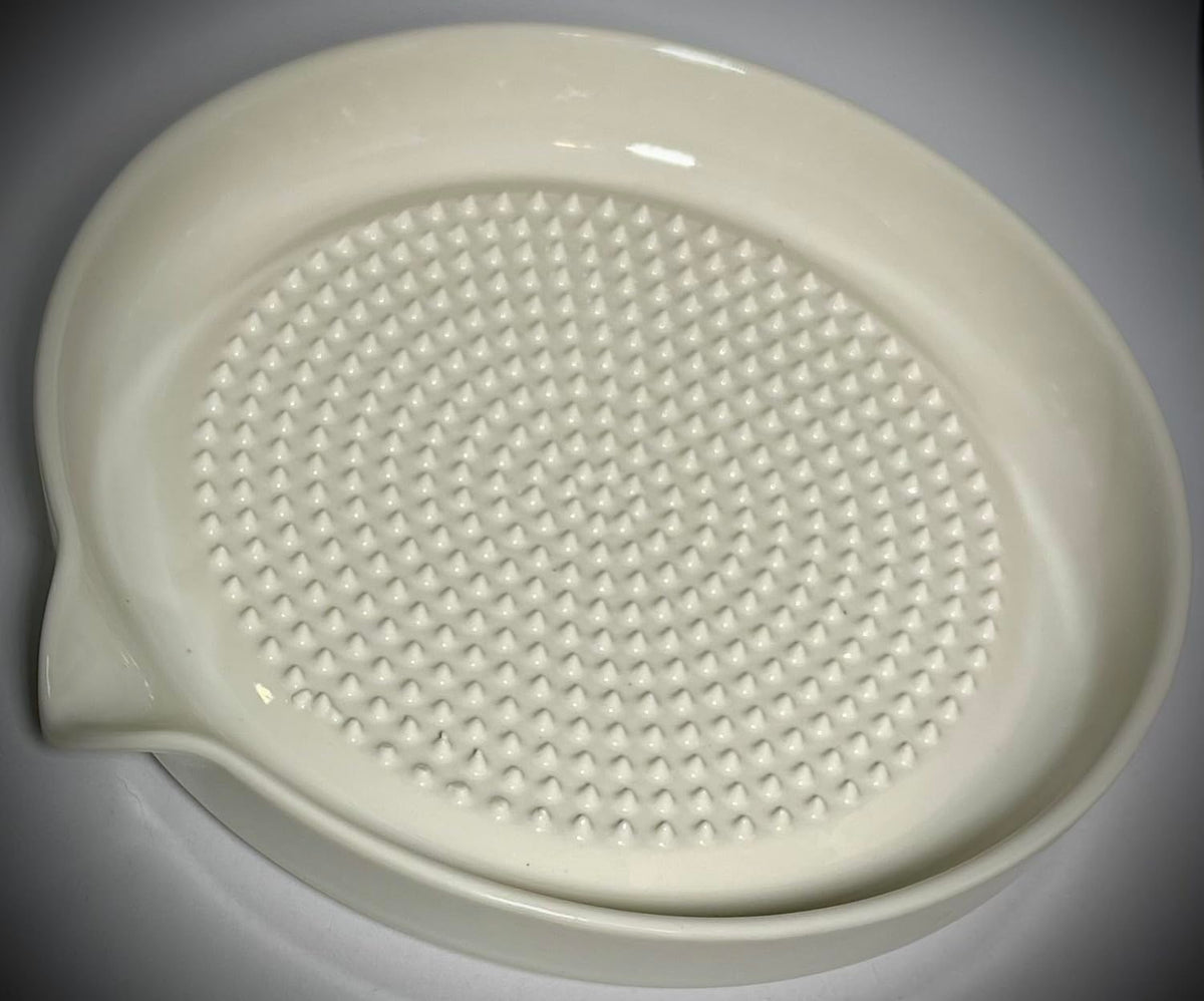 BonCera parmesan cheese shavings lifted cleanly from ceramic surface.