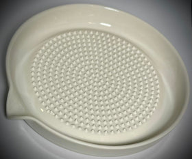 BonCera parmesan cheese shavings lifted cleanly from ceramic surface.