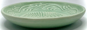 Turquoise green floral edge BonCera plate adds vibrant kitchen style.