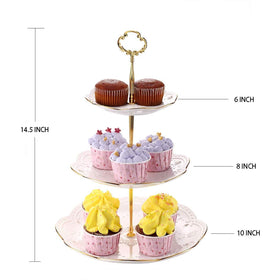 BonNoces pure white rimmed with gold dessert stand highlighting cakes and pastries.