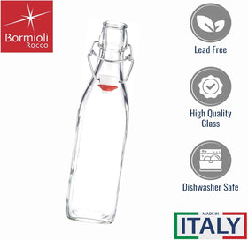 Bormioli Rocco Swing metal clamp close-up for secure resealing of juices.