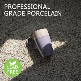 Bosmarlin 18 oz ceramic mug held in hand with comfortable leather sleeve grip.