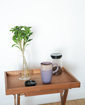 Bosmarlin mug seated in a car cup holder, ready for travel.
