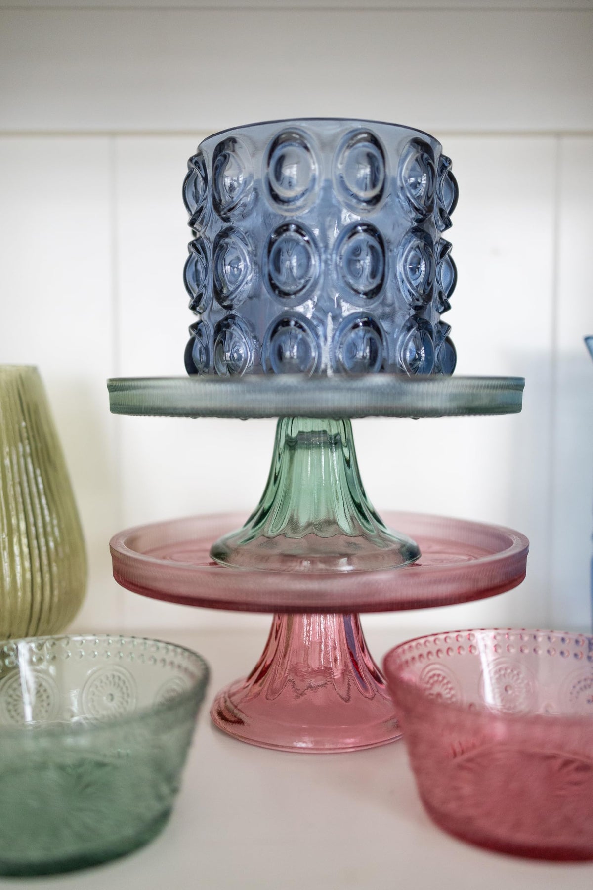 Sage green glass dessert display from Boston International enhances holiday treats