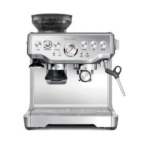 Breville Barista Express grinder dispensing into the portafilter for fresh espresso